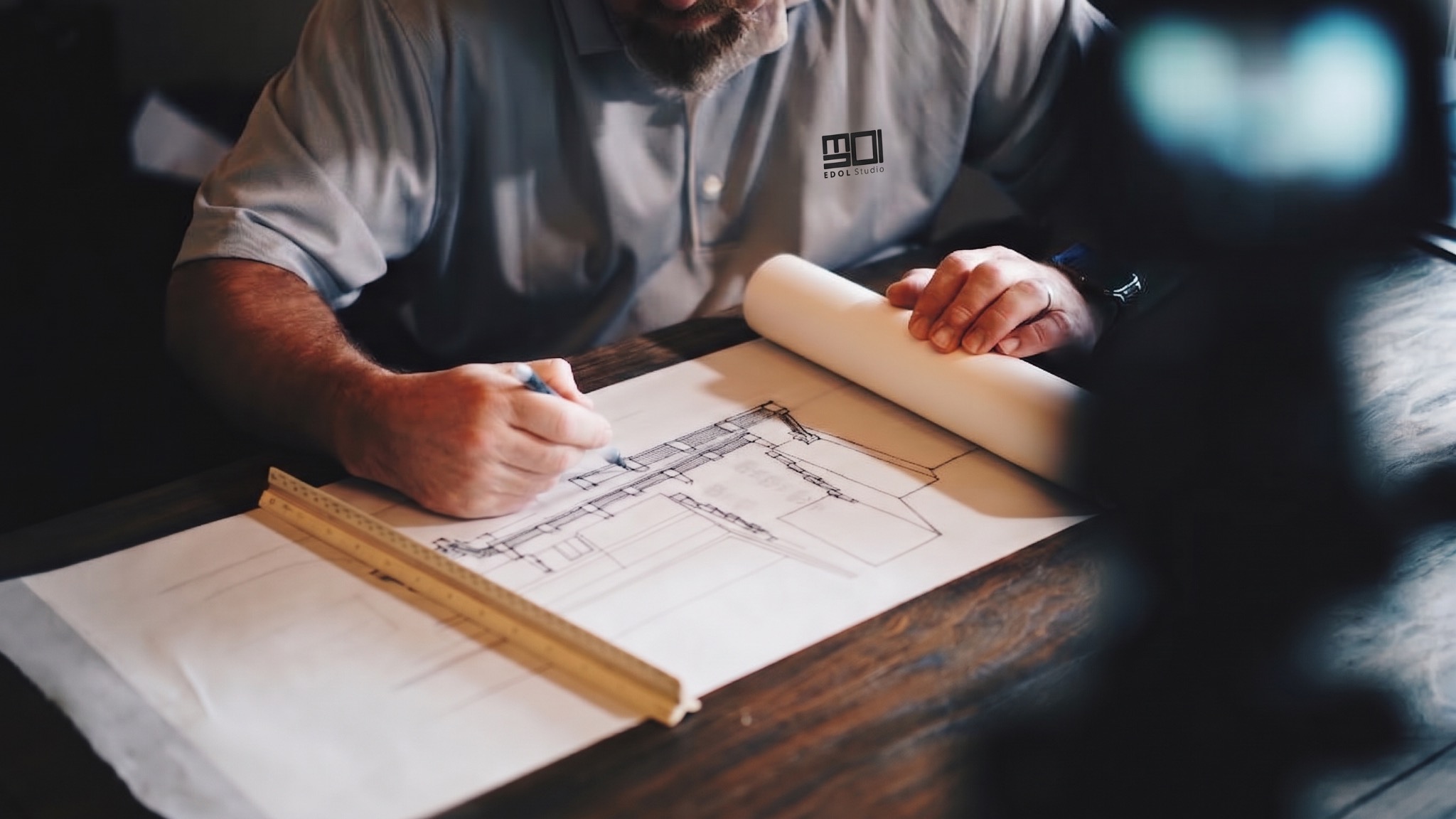 architectural plans and material samples on a design workspace